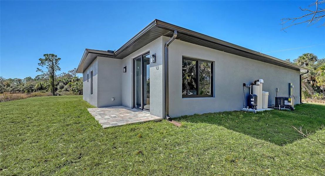 Exterior details and patio area of a home in , North Port (Image 19).