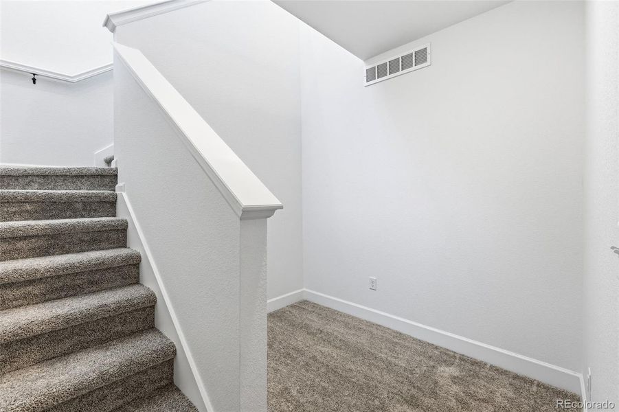 Spacious, unfurnished interior of a new home in The Cottages Collection at Ridgeline Vista, Brighton (Image 25).