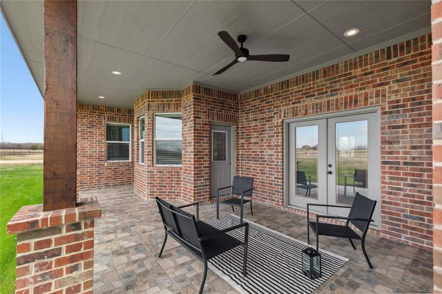 View of patio with french doors and a ceiling fan