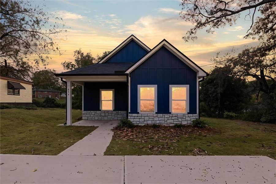 Front exterior of a new home in , Carrollton, GA, highlighting curb appeal (Image 21).