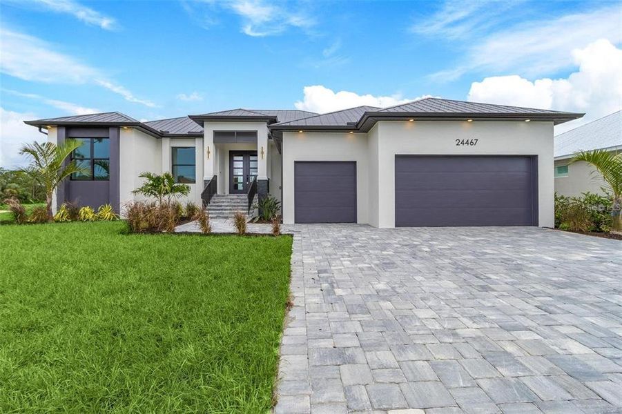 Front exterior of a new home in , Punta Gorda, FL, highlighting curb appeal (Image 11).