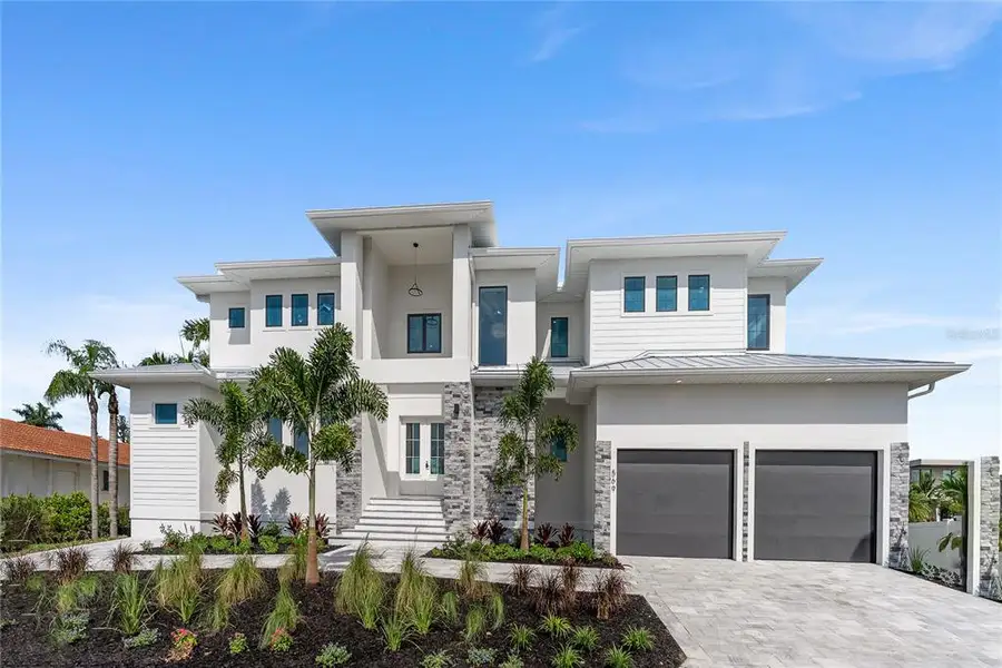 Front exterior of a new home in , Longboat Key, FL, highlighting curb appeal (Image 23). Front exterior of a new home in , Longboat Key, FL, highlighting curb appeal (Image 23).