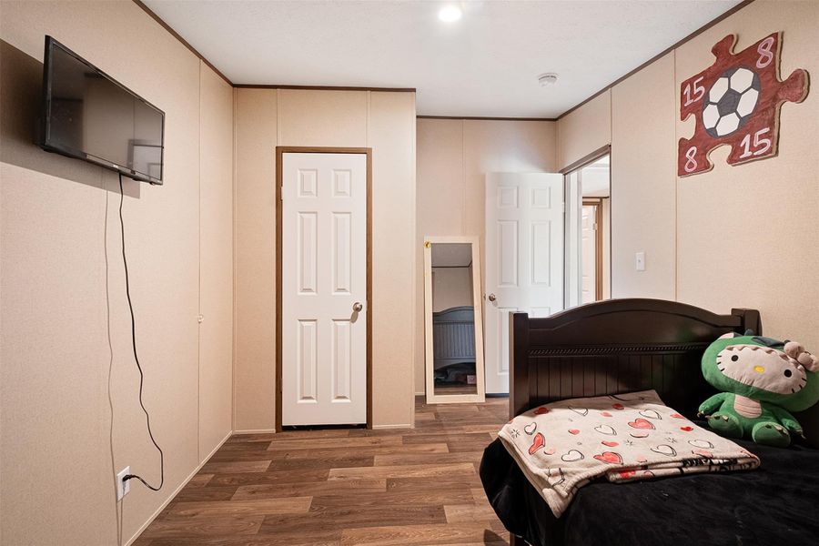 Bedroom featuring dark wood-style floors