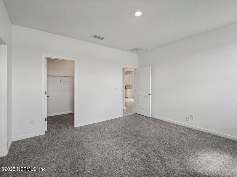 Spacious, unfurnished interior of a new home in Lakes at Bella Lago - Signature Series, Green Cove Springs (Image 21).