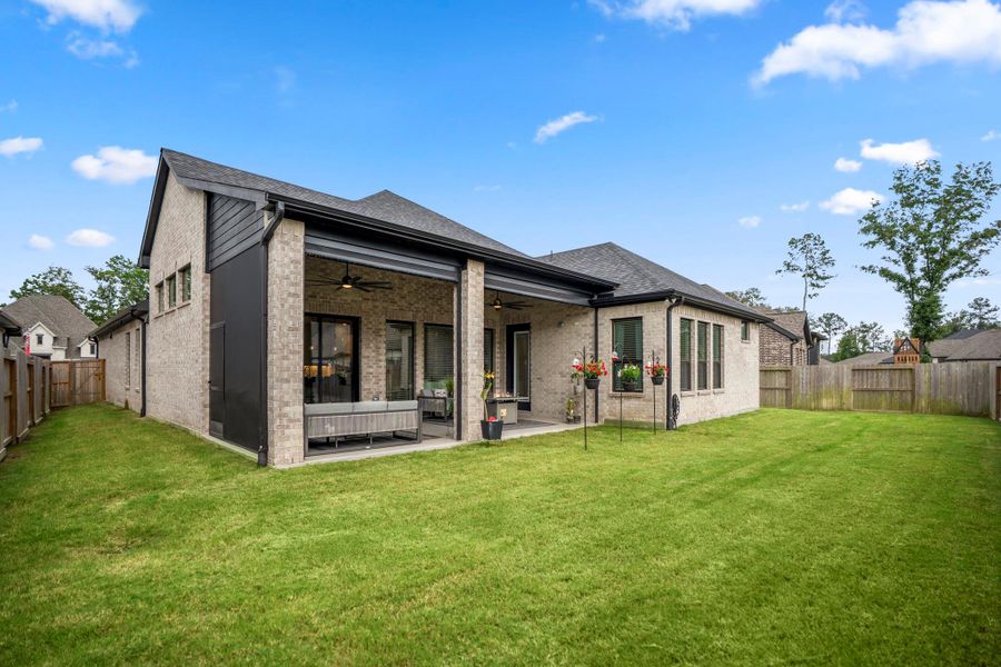 Exterior details and patio area of a home in The Highlands - 65', Porter (Image 23).