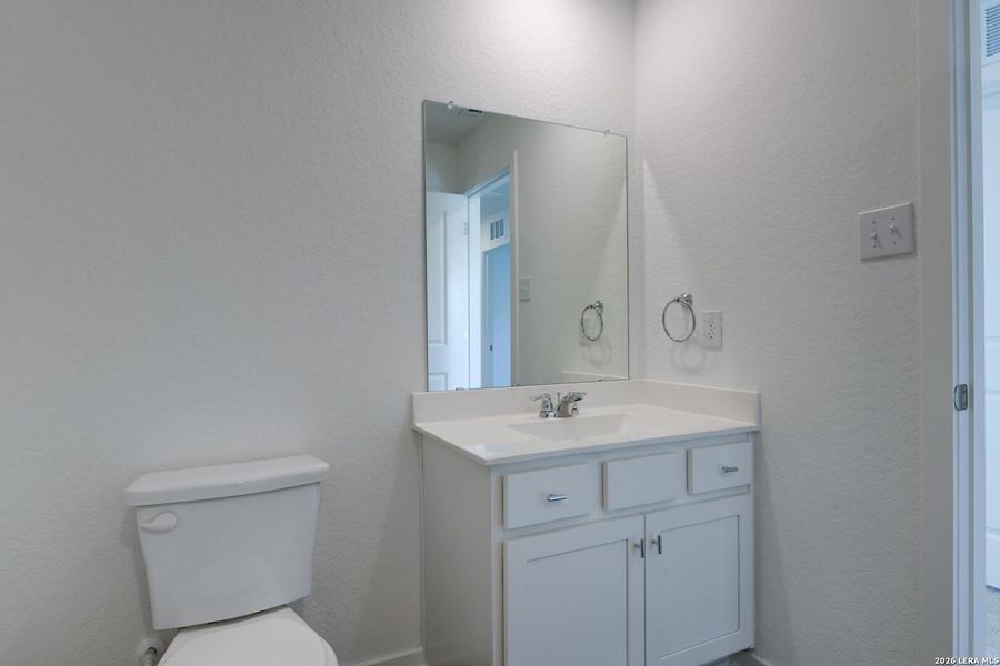 Furnished interior view inside a new home in Hennersby Hollow, San Antonio (Image 11).