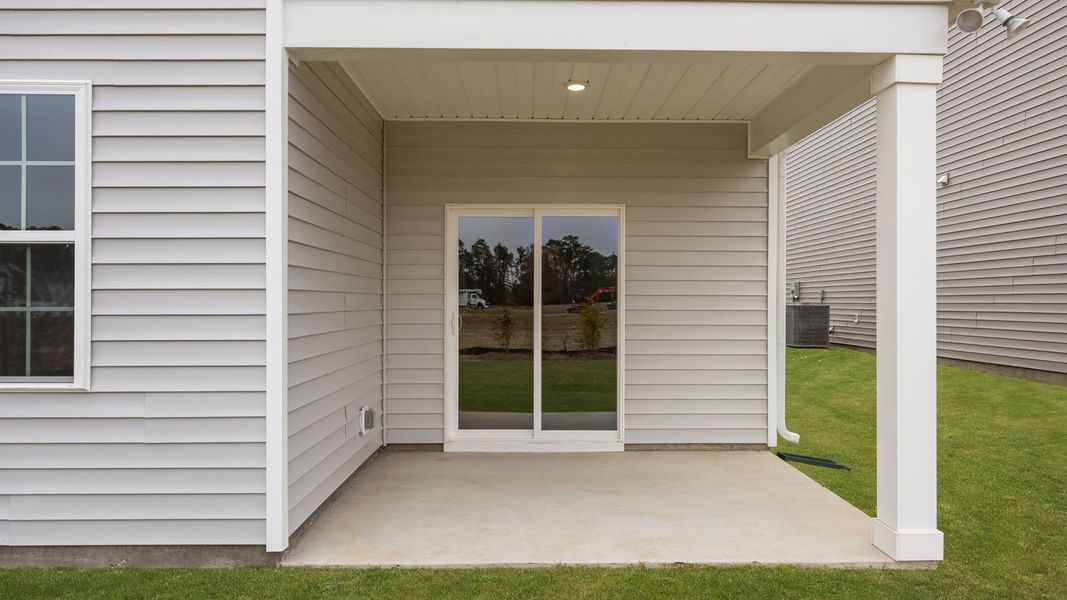 Exterior details and patio area of a home in Ridgewood Farms, Winterville (Image 4).
