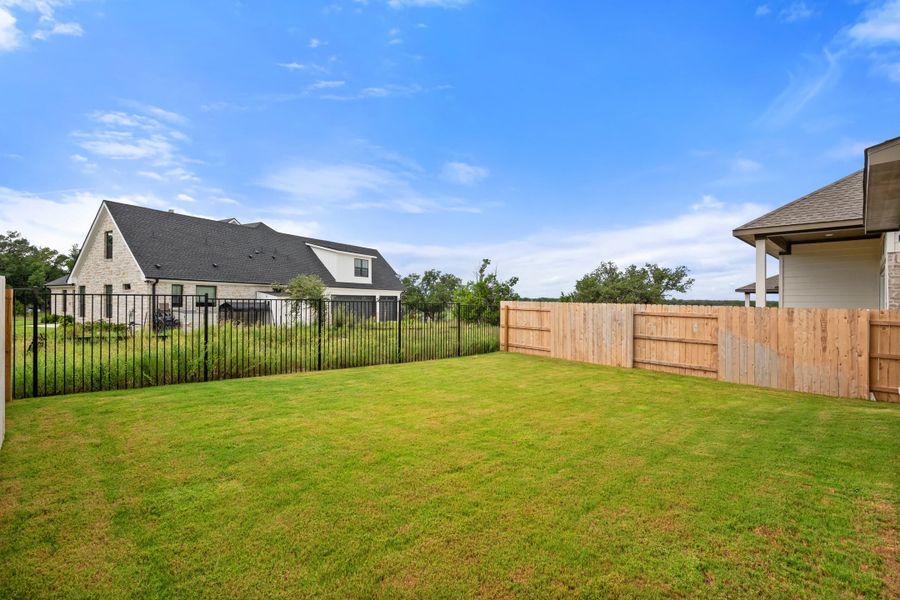 Exterior details and patio area of a home in Lariat, Liberty Hill (Image 33).