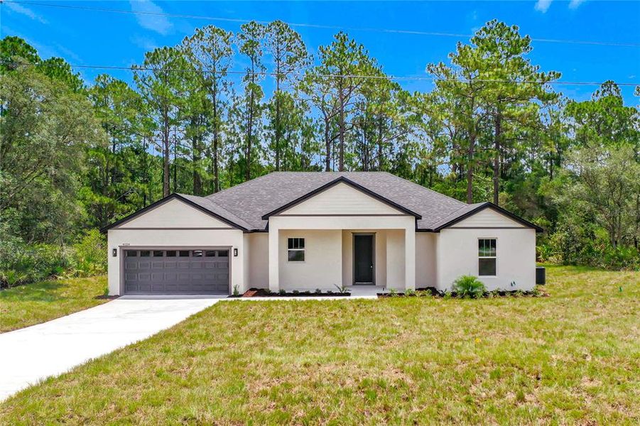Front exterior of a new home in , Eustis, FL, highlighting curb appeal (Image 2). Front exterior of a new home in , Eustis, FL, highlighting curb appeal (Image 2).