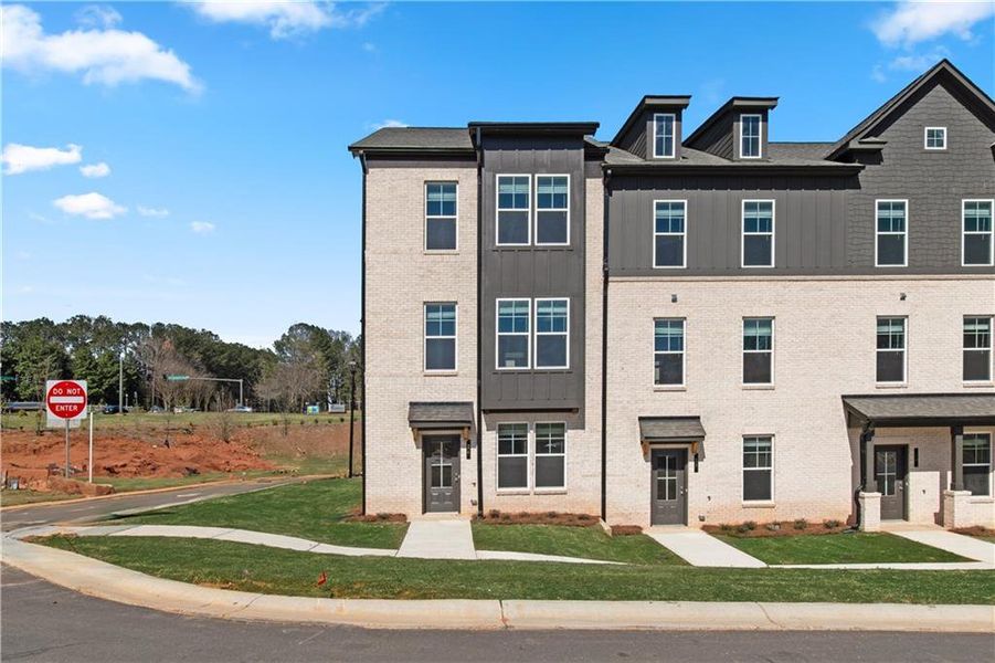 Front exterior of a new home in Daybreak, Newnan, GA, highlighting curb appeal (Image 16). Front exterior of a new home in Daybreak, Newnan, GA, highlighting curb appeal (Image 16).
