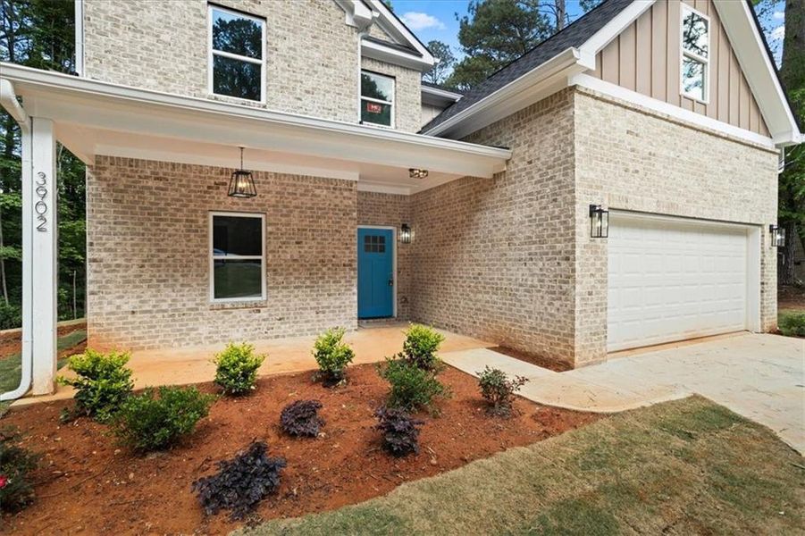 Front exterior of a new home in , Ellenwood, GA, highlighting curb appeal (Image 18).