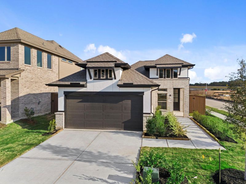 Front exterior of a new home in The Trails 40', New Caney, TX, highlighting curb appeal (Image 23).