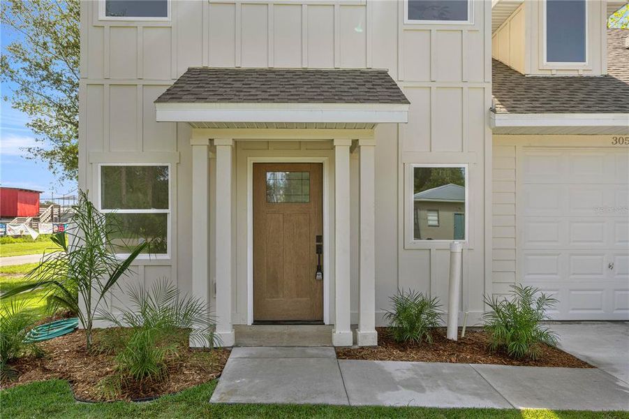 Front exterior of a new home in , Williston, FL, highlighting curb appeal (Image 2).