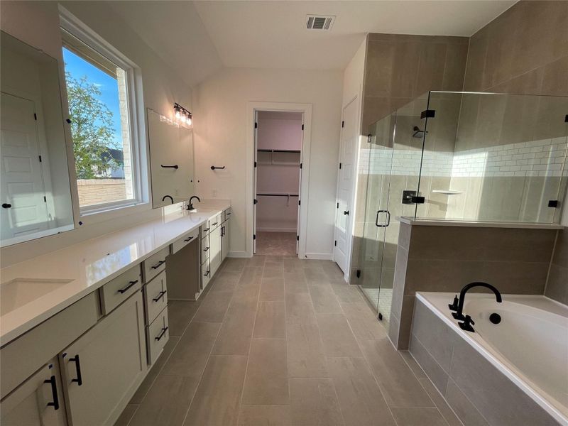 Primary Bath retreat with dual vanities, garden tub & walk-in shower
