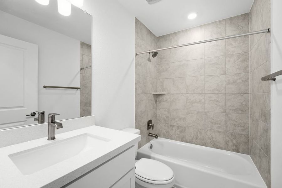 Furnished interior view inside a new home in Travisso, Leander (Image 9).