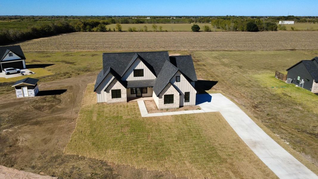 Front exterior of a new home in , Sealy, TX, highlighting curb appeal (Image 2). Front exterior of a new home in , Sealy, TX, highlighting curb appeal (Image 2).