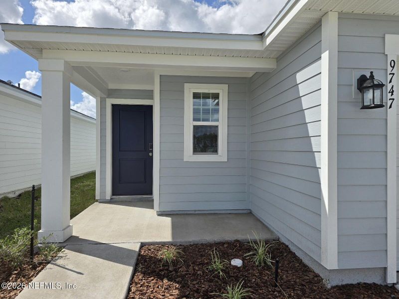 Exterior details and patio area of a home in Cypress Meadows - Classic Series, Jacksonville (Image 3).