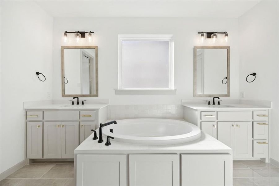 You'll enjoy ample room for two in this lovely owner's bath. You'll enjoy ample room for two in this lovely owner's bath.