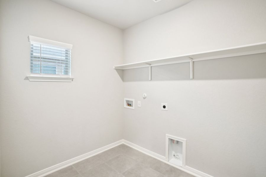 Laundry room of the Reynolds floorplan at a Meritage Homes community.