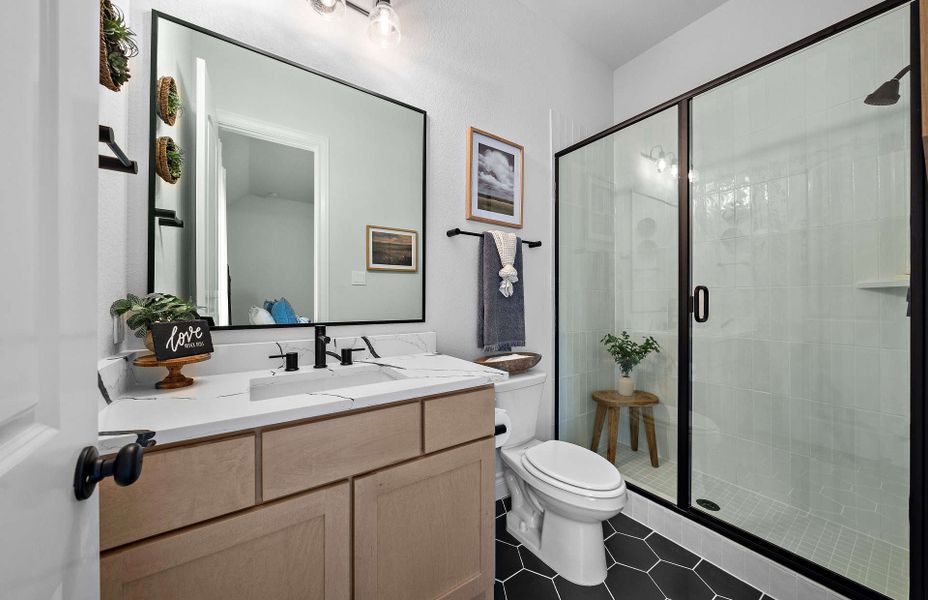 Representative furnished interior of a home built from the 2855 by Ravenna Homes in The Woodlands Hills 65′, Willis (Image 41).
