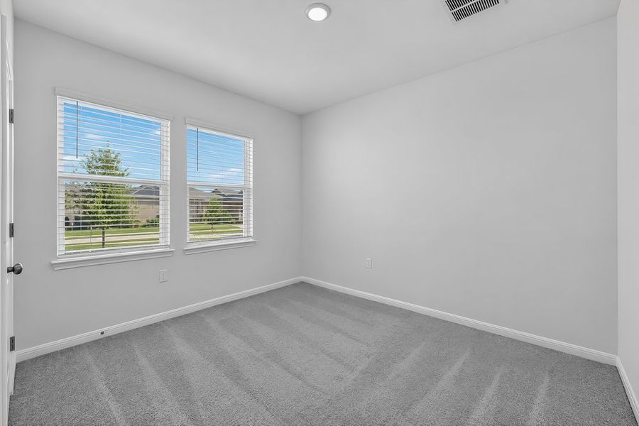 Representative unfurnished interior of a home built from the Warbler by Taylor Morrison in Longview, Del Valle (Image 20).