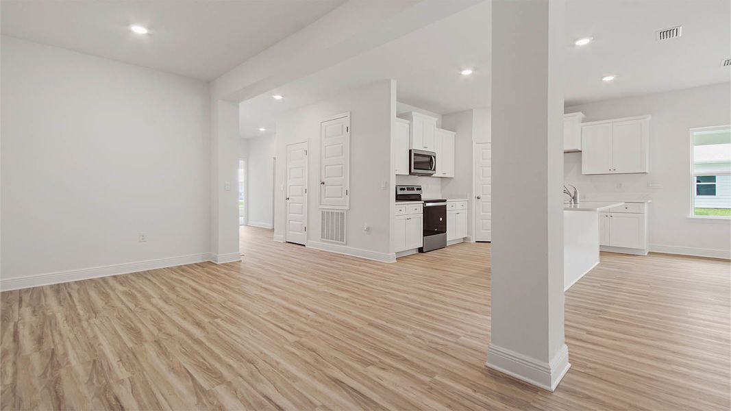 Representative unfurnished interior of a home built from the Kennedy by D.R. Horton in Bayside at Ward Creek, Panama City Beach (Image 33).
