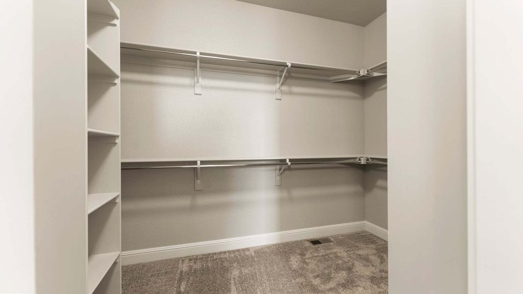 Primary Closet - Not Actual Home - Finishes May Vary