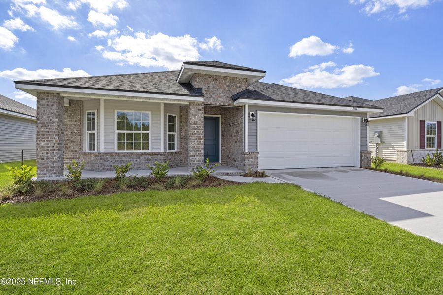 Front exterior of a new home in Summerglen, Jacksonville, FL, highlighting curb appeal (Image 2).