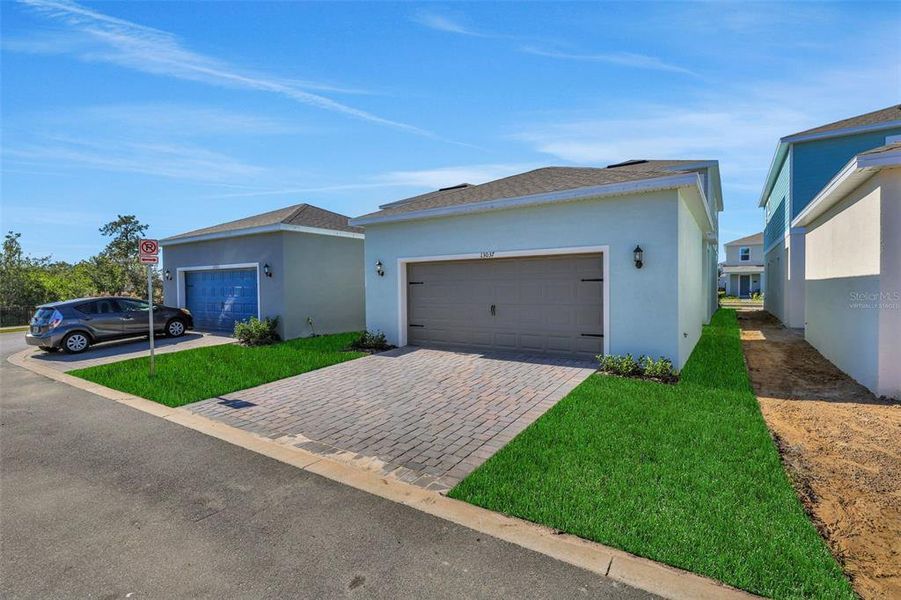 Exterior details and patio area of a home in Serenade at Ovation, Winter Garden (Image 3).