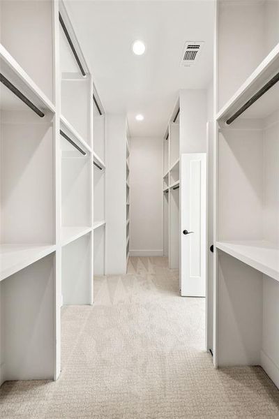 Walk in closet with light colored carpet Walk in closet with light colored carpet