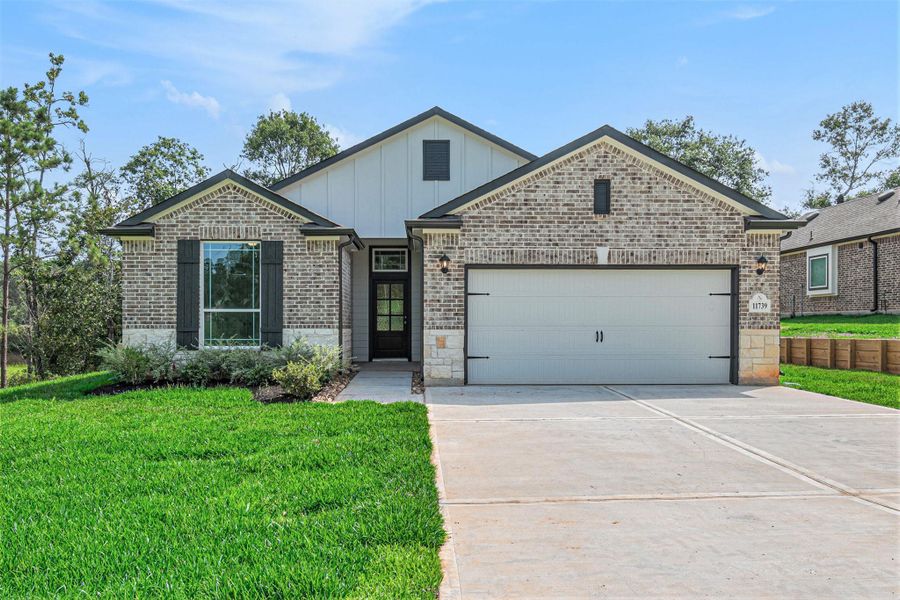 Front exterior of a new home in Oakwood Ranch, Willis, TX, highlighting curb appeal (Image 20).