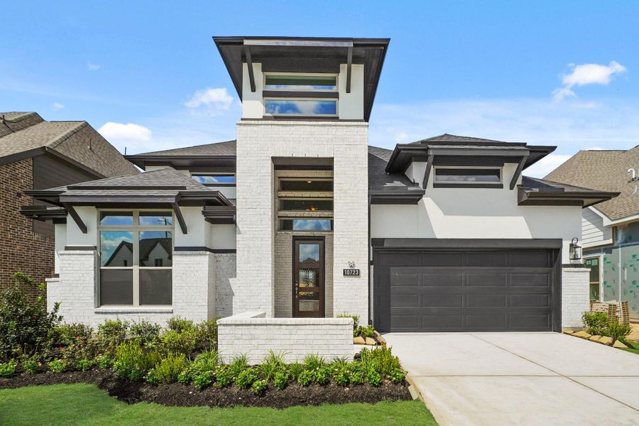 Front exterior of a new home in Bridgeland 55', Cypress, TX, highlighting curb appeal (Image 1).