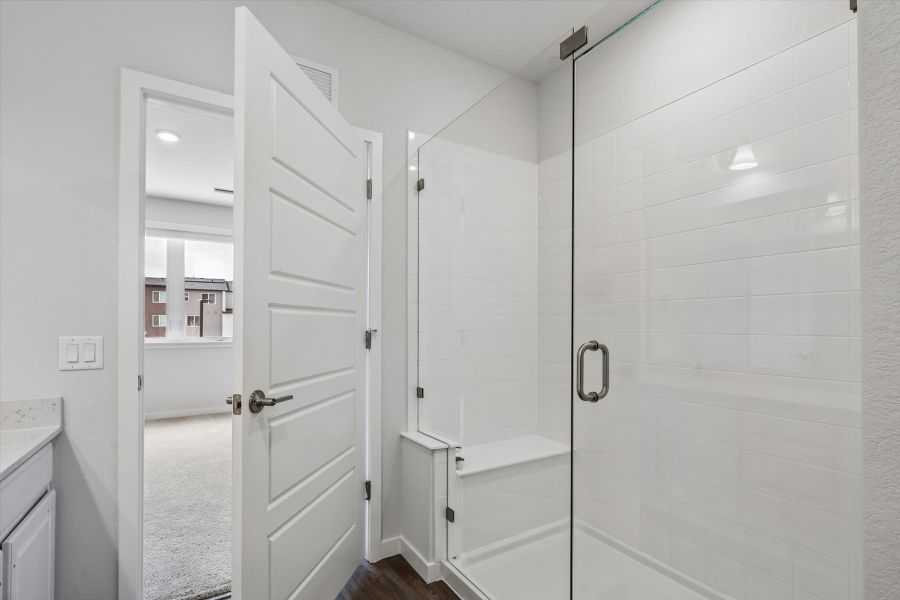 A bathroom with white doors. A bathroom with white doors.