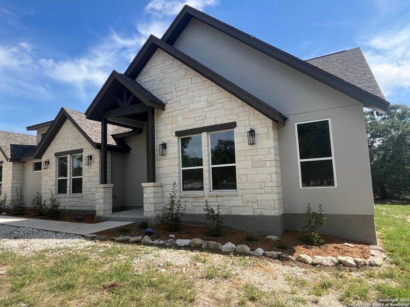 Front exterior of a new home in , Spring Branch, TX, highlighting curb appeal (Image 18).
