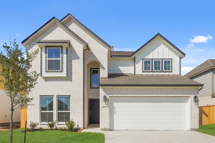 Front exterior of a new home in Huntington Place, Rosharon, TX, highlighting curb appeal (Image 2). Front exterior of a new home in Huntington Place, Rosharon, TX, highlighting curb appeal (Image 2).