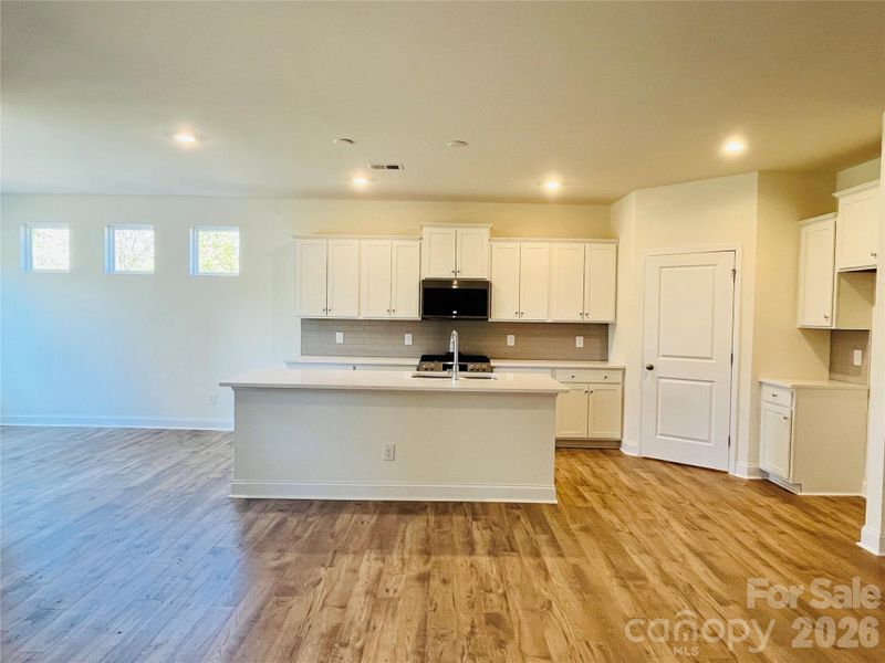 The kitchen is open to the great room and dining area