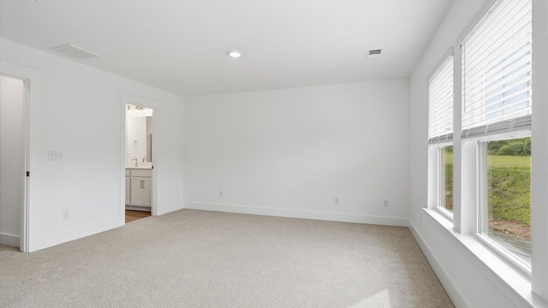 Spacious and serene primary suite with thoughtful design in a desirable DRB Homes community Spacious and serene primary suite with thoughtful design in a desirable DRB Homes community