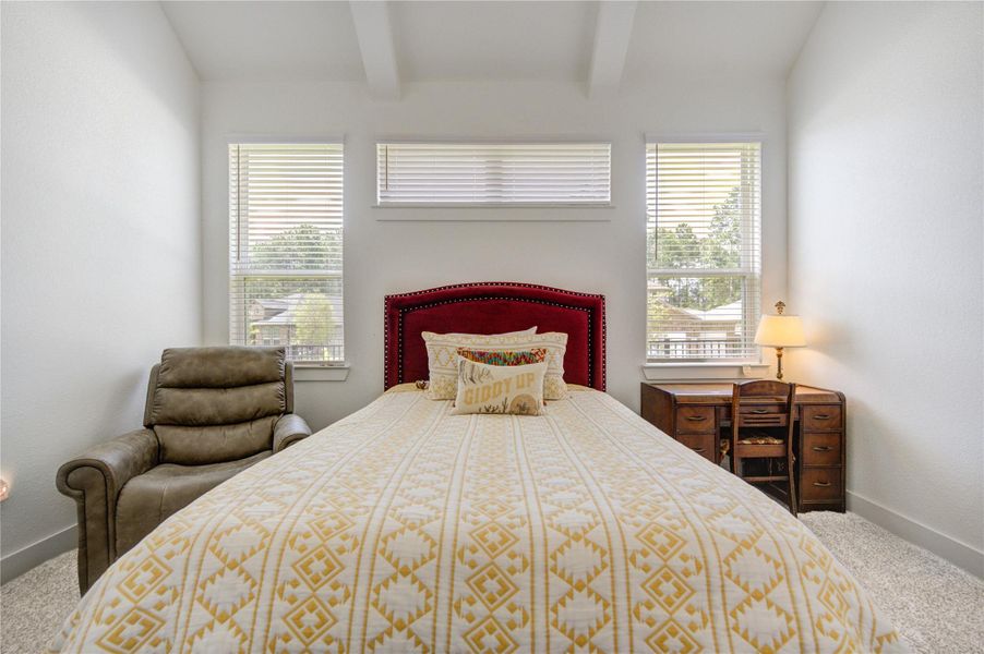 Large windows fill the primary bedroom with natural light, creating a bright and peaceful retreat. Large windows fill the primary bedroom with natural light, creating a bright and peaceful retreat.