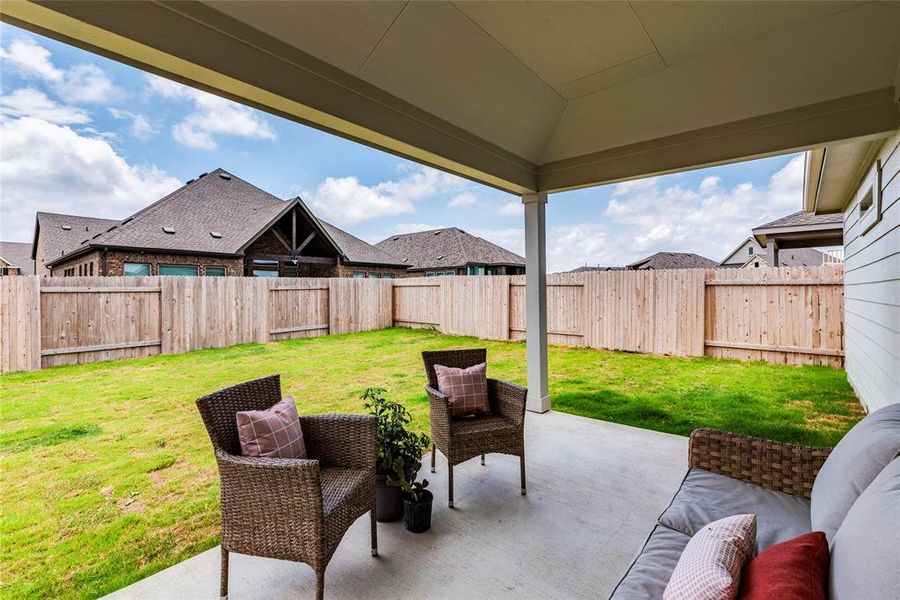 Covered patio ready for you to relax on.