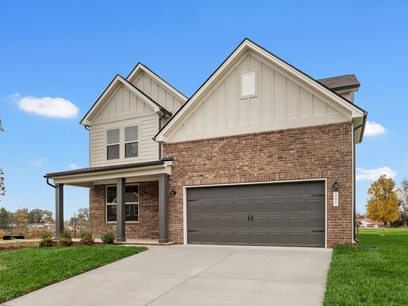 Front exterior of a new home in Woods Crossing, Gallatin, TN, highlighting curb appeal (Image 22).