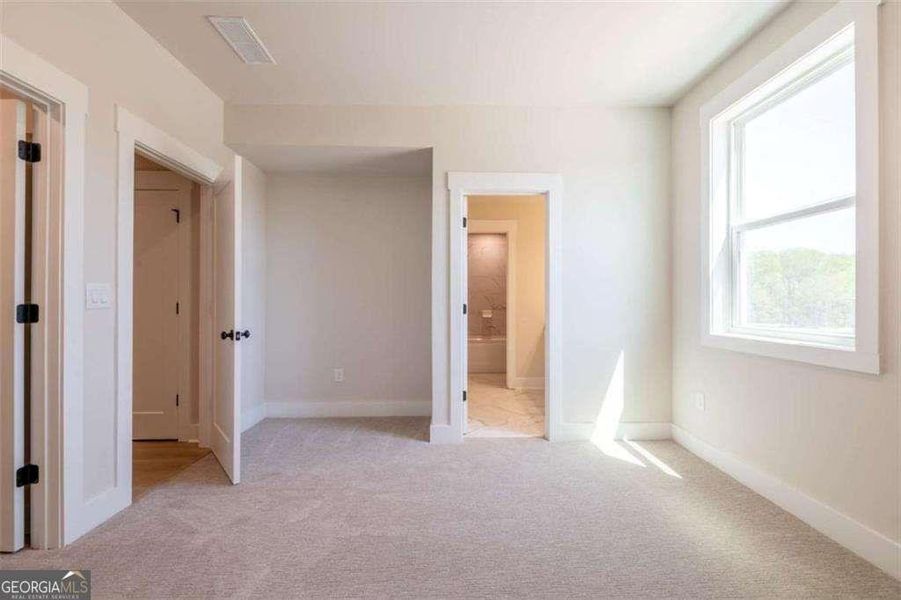 Spacious, unfurnished interior of a new home in The Paddocks at Doc Hughes, Buford (Image 29).