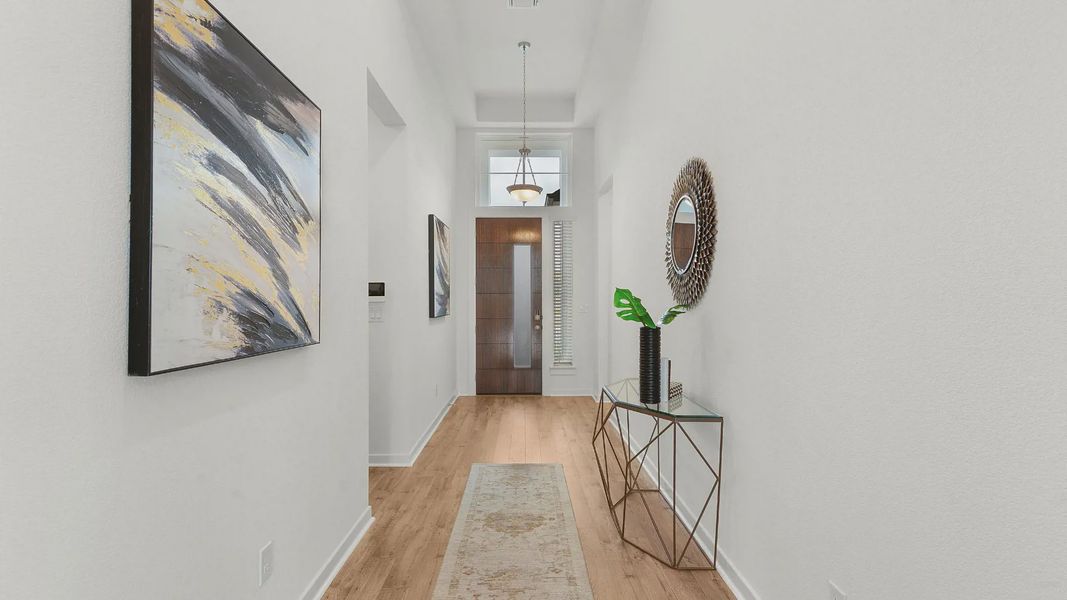 Representative furnished interior of a home built from the Lauren by Chesmar Homes in University Heights, Round Rock (Image 4).