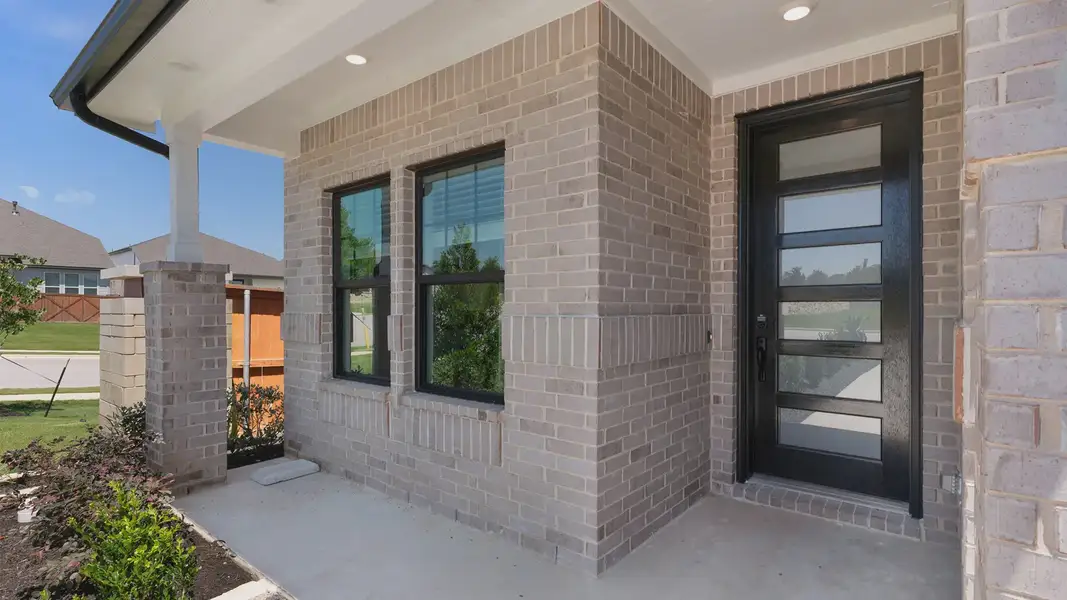 Exterior details and patio area of a home in The Grove at Blackhawk, Pflugerville (Image 1). Exterior details and patio area of a home in The Grove at Blackhawk, Pflugerville (Image 1).