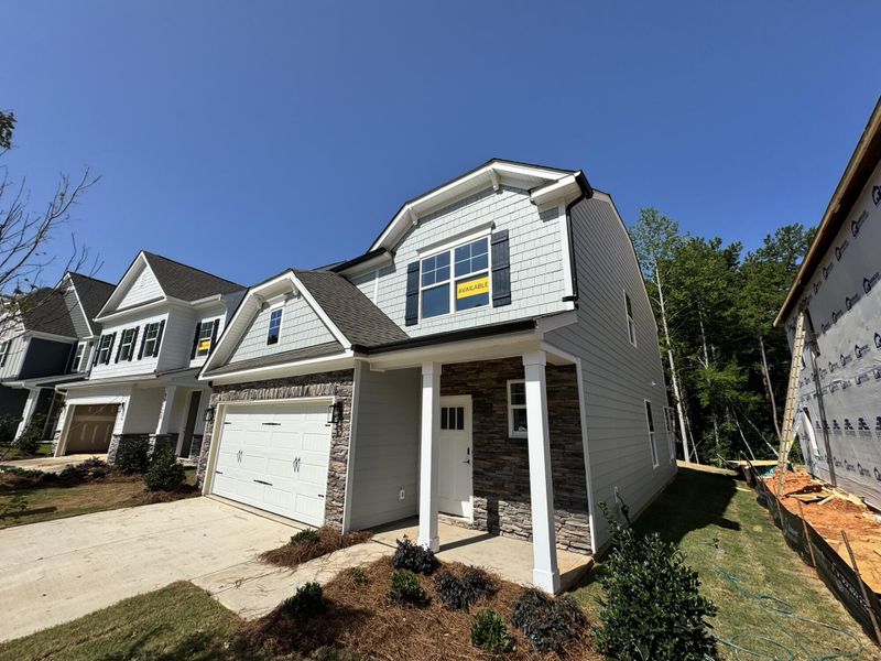 Front exterior of a new home in Caldwell Forest, Charlotte, NC, highlighting curb appeal (Image 2). Front exterior of a new home in Caldwell Forest, Charlotte, NC, highlighting curb appeal (Image 2).