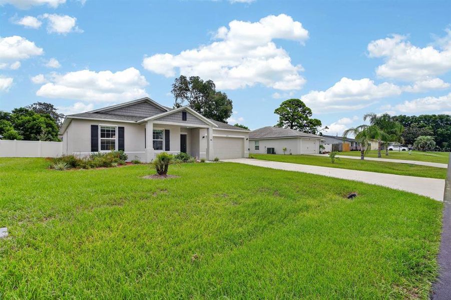 Front exterior of a new home in , Edgewater, FL, highlighting curb appeal (Image 25). Front exterior of a new home in , Edgewater, FL, highlighting curb appeal (Image 25).