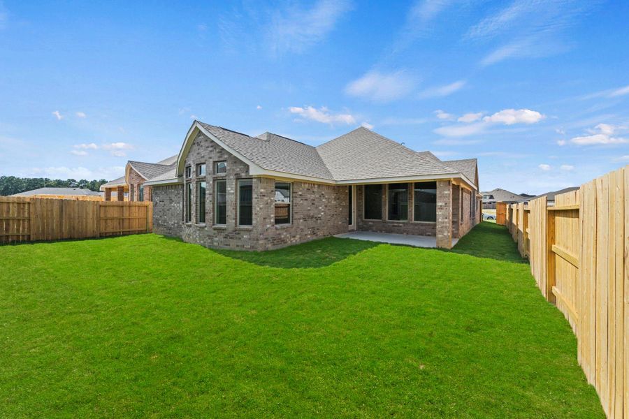 Exterior details and patio area of a home in The Trails, New Caney (Image 24).