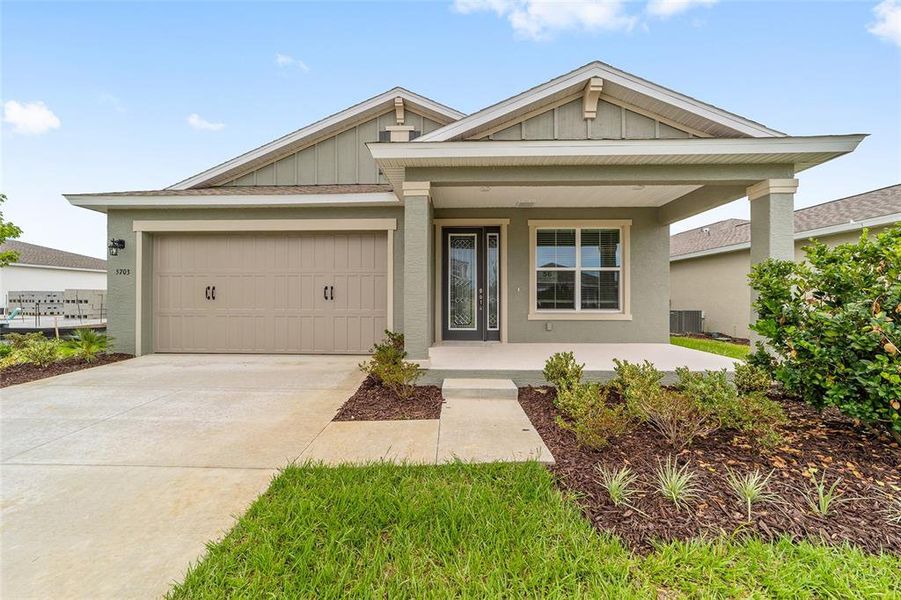 Front exterior of a new home in Calesa Township, Ocala, FL, highlighting curb appeal (Image 21). Front exterior of a new home in Calesa Township, Ocala, FL, highlighting curb appeal (Image 21).
