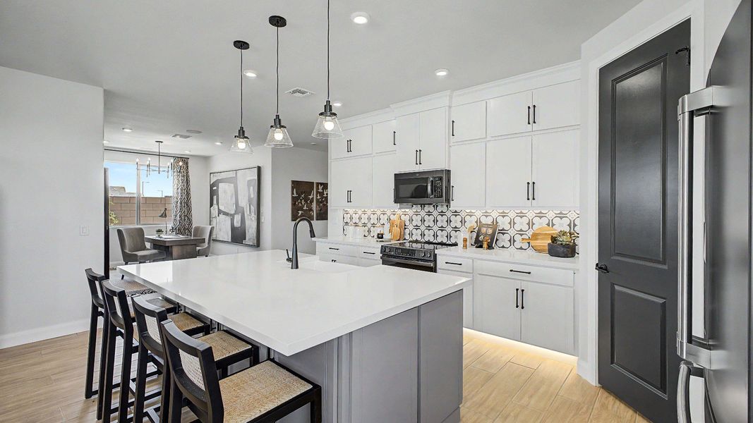 Modern kitchen island in this quick move-in new home by DRB Homes at Saguaro Hills at Vistancia, 32407 N 123rd Dr. Modern kitchen island in this quick move-in new home by DRB Homes at Saguaro Hills at Vistancia, 32407 N 123rd Dr.