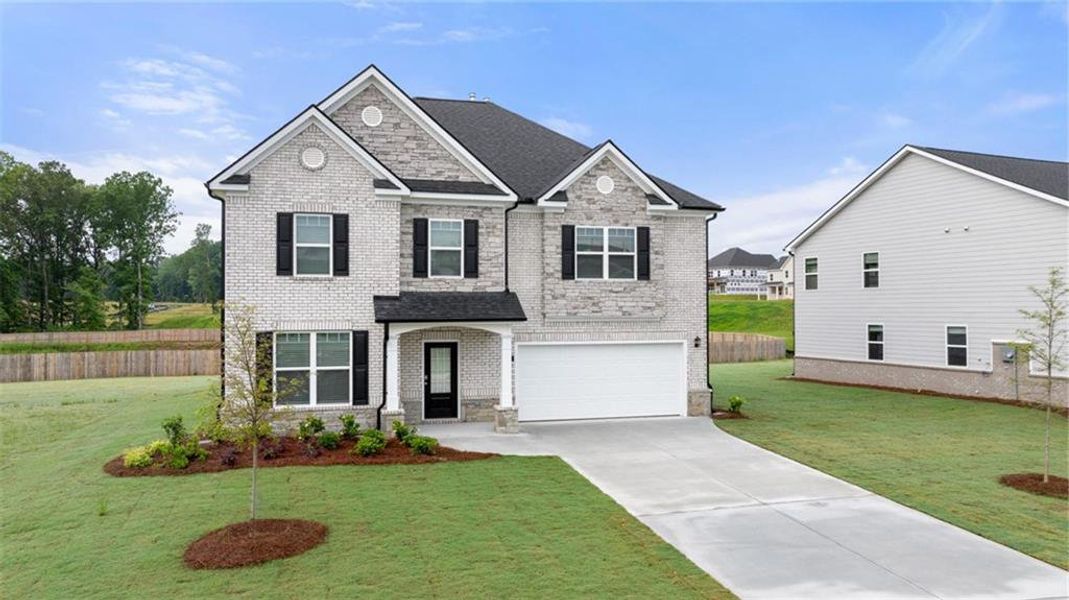 Front exterior of a new home in Independence, Loganville, GA, highlighting curb appeal (Image 1).