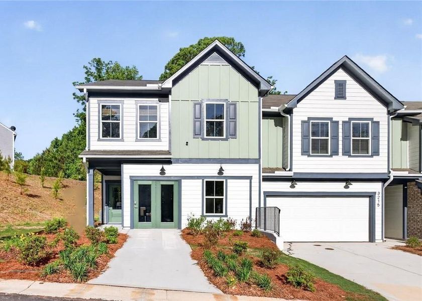 Front exterior of a new home in Ansley Towns, Cumming, GA, highlighting curb appeal (Image 1). Front exterior of a new home in Ansley Towns, Cumming, GA, highlighting curb appeal (Image 1).
